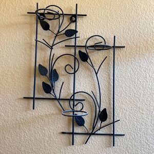 This black brass candle holder with leafy styles good for wall decor